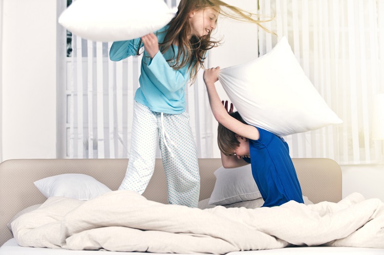 Kids having a pillow fight